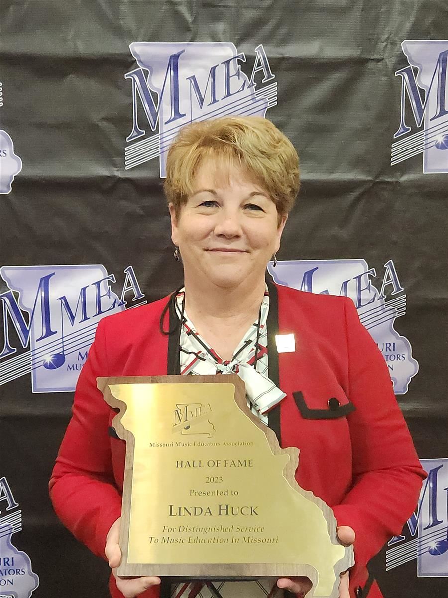  Lindbergh Schools Music Coordinator Linda Huck holds her 2023 MMEA Hall of Fame award
